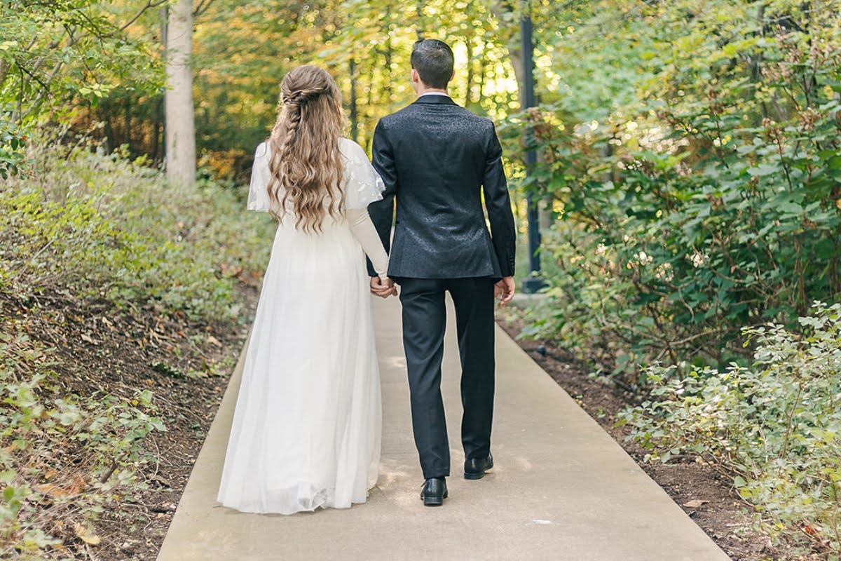 Bride and groom taking first look wedding photos.